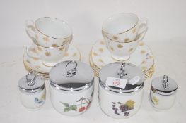 SET OF FOUR GRADUATED ROYAL WORCESTER EGG CODDLERS TOGETHER WITH CUPS AND SAUCERS