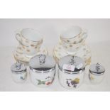 SET OF FOUR GRADUATED ROYAL WORCESTER EGG CODDLERS TOGETHER WITH CUPS AND SAUCERS