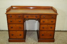 SMALL VICTORIAN KNEEHOLE DESK WITH CARVED DECORATION AND RAILED TOP, WIDTH APPROX 113CM