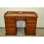 SMALL VICTORIAN KNEEHOLE DESK WITH CARVED DECORATION AND RAILED TOP, WIDTH APPROX 113CM