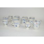 CUPS AND SAUCERS WITH BLUE AND WHITE DESIGN