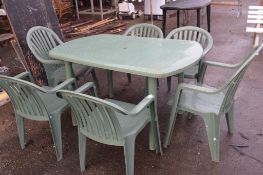 PLASTIC PATIO TABLE AND SET OF SIX CHAIRS