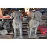 PAIR OF COMPOSITION GARDEN ORNAMENTS OF SEATED HOUNDS