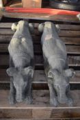 PAIR OF COMPOSITION GARDEN ORNAMENTS OF RECUMBENT DOGS 75CM X 24CM