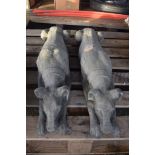 PAIR OF COMPOSITION GARDEN ORNAMENTS OF RECUMBENT DOGS 75CM X 24CM