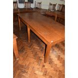 Large early 20th century long oak office table on six square tapering legs