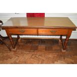 Victorian mahogany long two-drawer side table, on turned legs, end stretchers and having applied