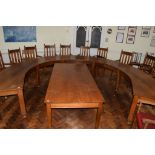 Set of three early 20th century oak committee tables of curved design, each on four chamfered square