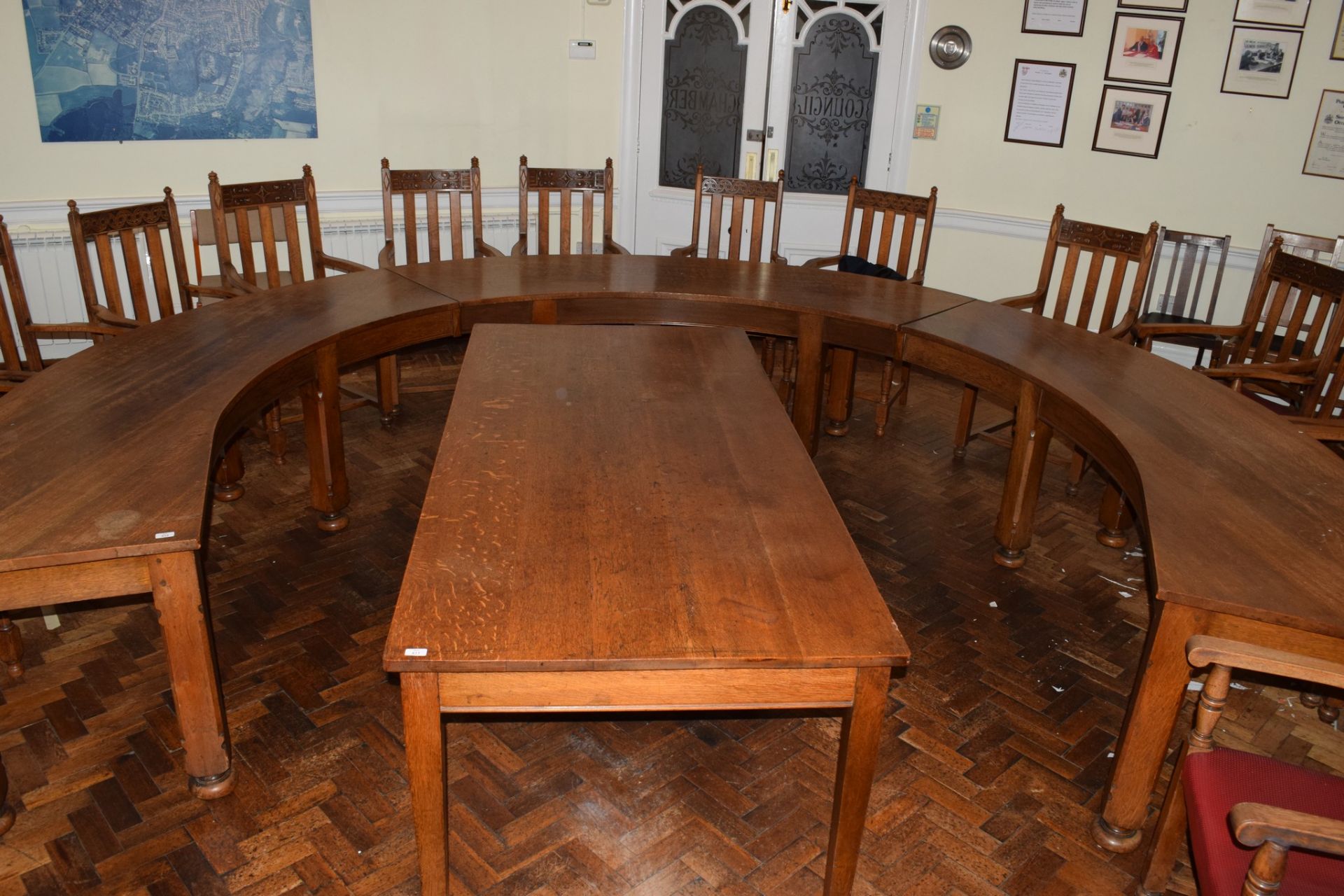 Set of three early 20th century oak committee tables of curved design, each on four chamfered square