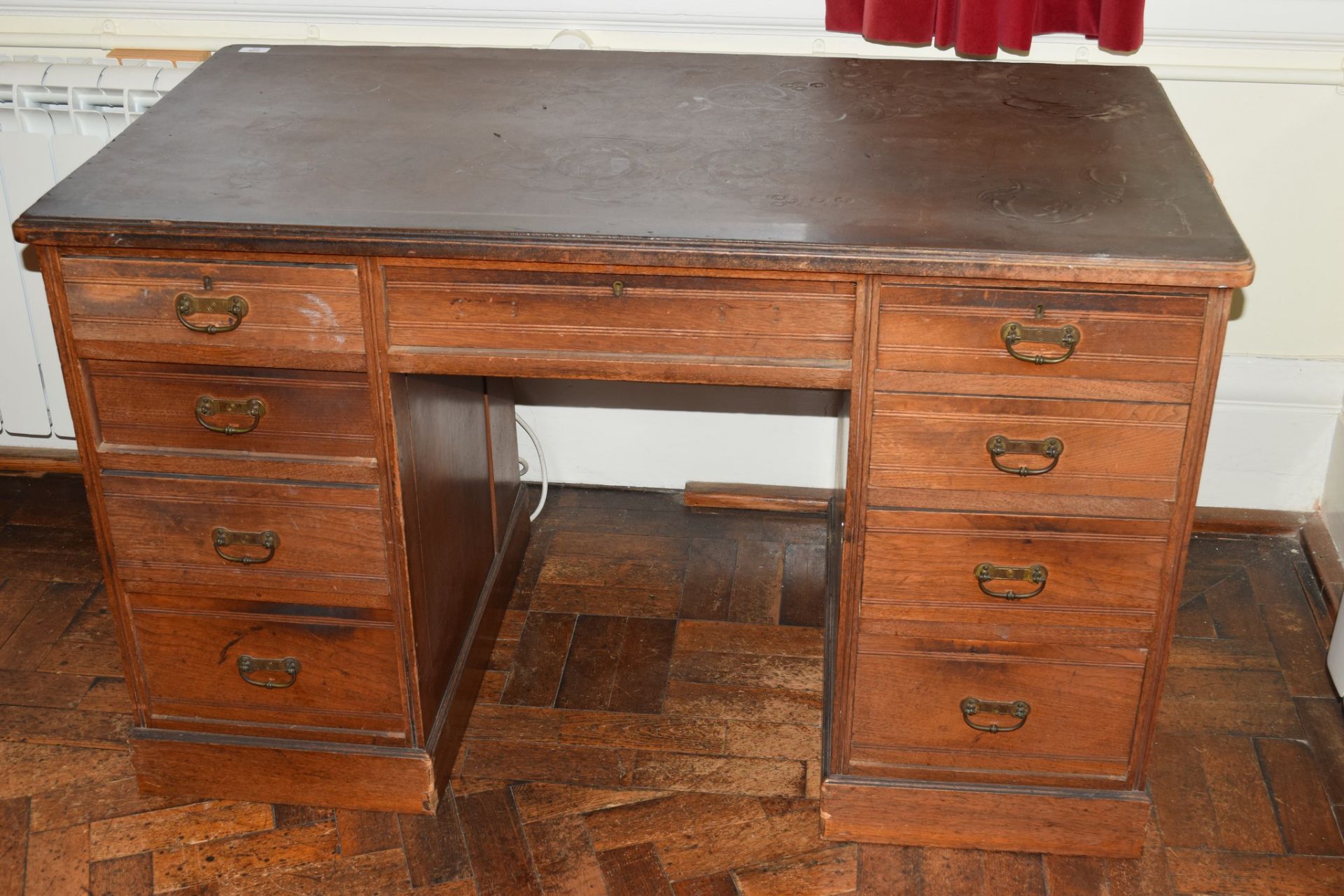 Late Victorian walnut, twin pedestal 9-drawer desk with brass drop handles (applied composition top)