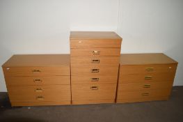 THREE PIECE BEDROOM SUITE COMPRISING TWO LONG CHESTS OF DRAWERS AND A TALLBOY WITH OPENING