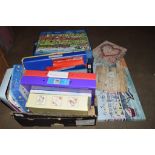 BOX CONTAINING JIGSAWS AND PICTURES