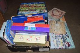 BOX CONTAINING JIGSAWS AND PICTURES