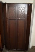 MID-20TH CENTURY OAK SINGLE WARDROBE WITH CARVED DECORATION BY HEATHLAND FURNITURE, WIDTH APPROX