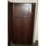 MID-20TH CENTURY OAK SINGLE WARDROBE WITH CARVED DECORATION BY HEATHLAND FURNITURE, WIDTH APPROX