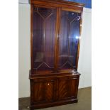 REPRODUCTION MAHOGANY BOOKCASE WITH CUPBOARD BENEATH, APPROX WIDTH 105CM (MATCHES LOT NO 305)