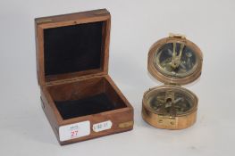 BOX CONTAINING A COMPASS