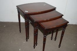 SET OF THREE BOW FRONTED MAHOGANY EFFECT NESTING TABLES, WIDTH APPROX 51CM