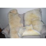 TWO SHEEPSKIN RUGS, EACH LENGTH APPROX 150CM