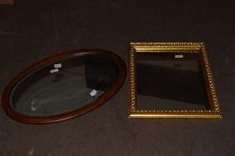 MIRROR IN OVAL MAHOGANY FRAME