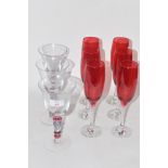 SIX RED COLOURED GLASS WINE GLASSES TOGETHER WITH FURTHER THREE GLASSES WITH MULTI-COLOURED TWIST