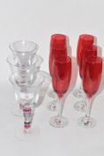 SIX RED COLOURED GLASS WINE GLASSES TOGETHER WITH FURTHER THREE GLASSES WITH MULTI-COLOURED TWIST