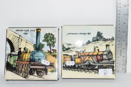 TWO CERAMIC TEA POT STANDS FEATURING OLD RAILWAY ENGINES