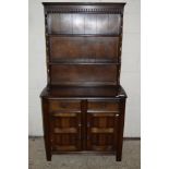 SMALL OAK EFFECT REPRODUCTION DRESSER WITH CARVED DECORATION, WIDTH APPROX 92CM