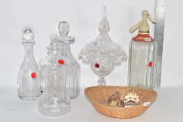 CUT GLASS DECANTERS AND STOPPERS AND A SODA SIPHON