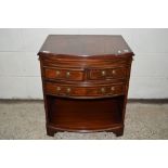 SMALL MAHOGANY FINISH BOW FRONTED LOW CHEST WITH LEATHER INSET BRUSHING SLIDE AND CROSS BANDED