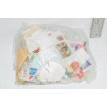SMALL PLASTIC BAG CONTAINING STAMPS