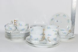 PART TEA SET BY LIMOGES IMPORTED BY FRANKS & CO LONDON WITH A FLORAL DESIGN COMPRISING PLATES,