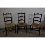 SET OF THREE RUSH SEATED LADDER BACK CHAIRS, EACH HEIGHT APPROX 102CM