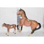 MELBA WARE MODEL OF A HORSE, TOGETHER WITH A LARGE HORSE MODEL