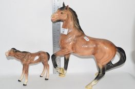 MELBA WARE MODEL OF A HORSE, TOGETHER WITH A LARGE HORSE MODEL