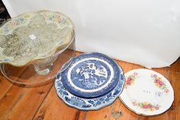 TWO GLASS CAKE STANDS AND SOME CERAMIC DISHES