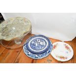 TWO GLASS CAKE STANDS AND SOME CERAMIC DISHES