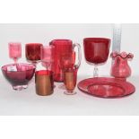 RED COLOURED CRANBERRY TYPE GLASS WARES INCLUDING JUG, VASE, BEAKERS WITH ENGRAVED DESIGN