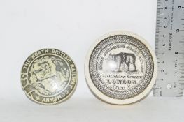 SMALL PLASTIC BOX CONTAINING TWO POT LID COVERS, ONE FOR JAMES ATKINSON'S BEAR'S GREASE, OLD BOND