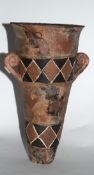 Tapering cone shaped vase with two small handles and geometric designs by A M Magson, 20cm high