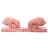 Pair of unusual pink pottery studies of mythological bulls standing on integral bases, 11cm high