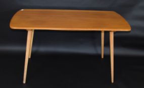 Mid-century light oak Ercol table and six chairs (two carvers), table 137cm wide