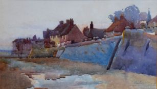 Hubert Coop, Coastal village, watercolour, signed and inscribed IOM lower right, 29 x 51cm