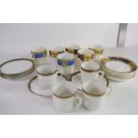 QUANTITY OF DECORATIVE COFFEE CANS AND SAUCERS
