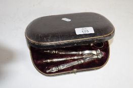 CASED SET OF SILVER PLATED GRAPE SHEARS AND NUTCRACKERS TOGETHER WITH A FURTHER SET OF SILVER PLATED