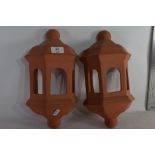 TWO TERRACOTTA CANDLE SCONCES