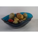ART GLASS FRUIT BOWL CONTAINING A SELECTION OF STONE EGGS
