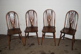 SET OF FOUR WHEEL BACK DINING CHAIRS
