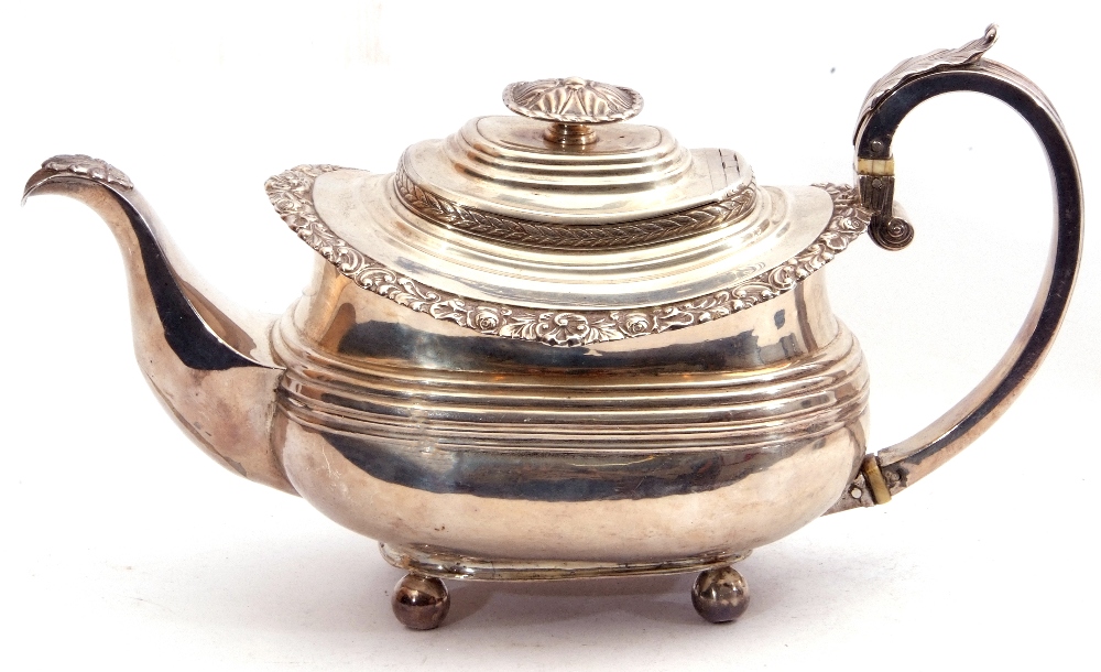 George IV silver tea pot of oval form having a reeded body with applied scroll and shell rim, a - Image 2 of 6