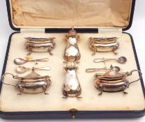 Cased 10-piece silver condiment set comprising two peppers, two mustards, two open salts and liners,